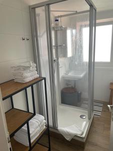 a bathroom with a shower and a sink at Ferienwohnungen Mews in Immenstadt im Allgäu +77 photos