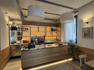 a large kitchen with a large counter in a room at La botte in Ferrara