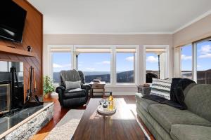 a living room with a couch and chairs and a tv at Overlook 08 with Wintergreen Advantage in Wintergreen
