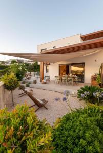an image of a house with a garden at Vodice For You - Holiday Homes in Vodice