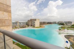 a view of a large swimming pool from a balcony at Baia Crystal Luxury Stay - Penthouse Vista a la Laguna in Cartagena de Indias
