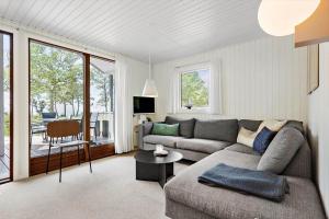 a living room with a couch and a table at 4705-Aakirkeby-Sondre-Landevej-60 in Åkirkeby