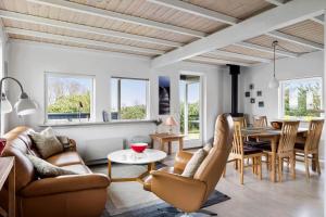 a living room with a couch and a table at 3688-Nexo-Olssonsvej-1 in Neksø