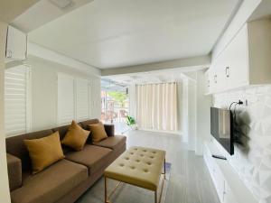 a living room with a couch and a table at Grospe Resort Boracay in Boracay
