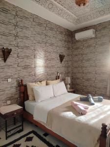 Una cama o camas en una habitación de Riad Andalousse