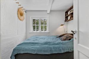 Una cama o camas en una habitación de 3672-Nexo-Rorvej-7