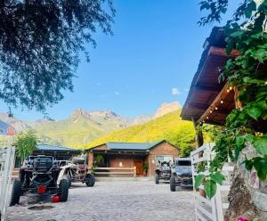 a group of atvs parked in front of a building at Cabañas Villa Escondida in Urique