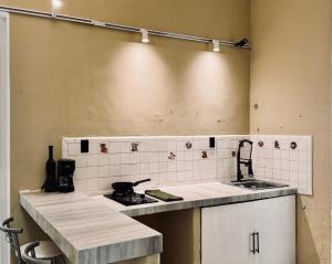 a kitchen with a sink and a counter top at Casa Zapata, Mérida Yucatán in Mérida +32 photos