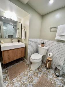 a bathroom with a toilet and a sink at Historic Suite on Prescott's Best Street! in Prescott