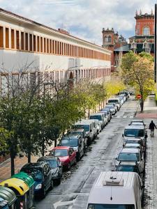 a row of cars parked next to a building at Palacio de Larrinaga in Zaragoza