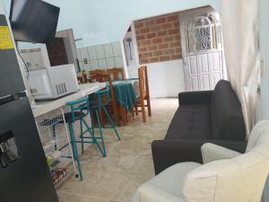 a living room with a couch and a table at Casa rural GuerrApa in San Agustín +26 photos