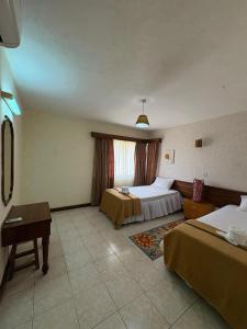 En eller flere senge i et værelse på Cozy 2 Bedroom Apartment + 29 billeder