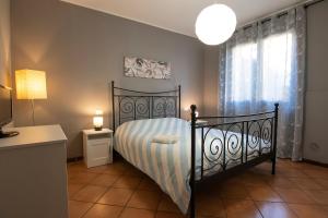 Postel nebo postele na pokoji v ubytování Milano Fiera WiFi Parcheggio Gratuito