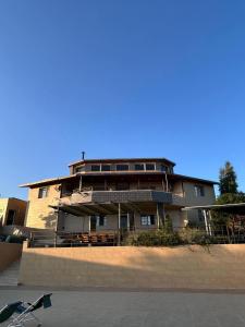 a large building in front of a building at Mountain farm in Ajloun