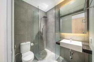 a bathroom with a toilet and a sink and a shower at Villa Nayana In The heart of Semiya in Seminyak +19 photos