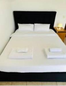 Ένα ή περισσότερα κρεβάτια σε δωμάτιο στο Central Located Rooms Lagos +6 φωτογραφίες