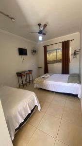 Katil atau katil-katil dalam bilik di Hotel Itiquira +35 gambar