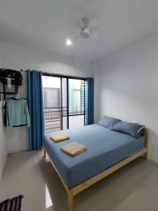 Postel nebo postele na pokoji v ubytování Den Nest Guest House KRABI