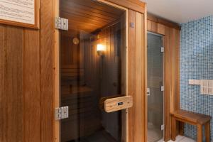 a glass door to a shower in a bathroom at The Old Farmhouse in Ponsanooth