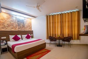 Ένα ή περισσότερα κρεβάτια σε δωμάτιο στο Hotel Luxury Global At Delhi Airport by Global Group +41 φωτογραφίες