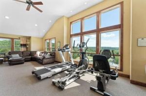 a living room with a gym with exercise equipment at HOME Filled with Love and Happiness in Hollister