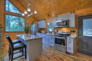 a kitchen with white cabinets and a stove top oven at Willow Falls in Blue Ridge