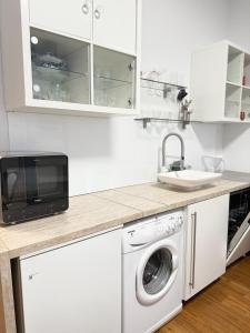 Η κουζίνα ή μικρή κουζίνα στο City apartment with private parking +5 φωτογραφίες