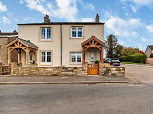 a large house with a brown door on a street at 2 Bed in Cockermouth 94787 in Broughton Moor