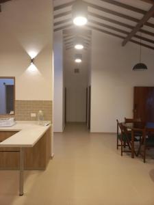 a large room with a counter and a dining room at Casa Nueva en Zapatoca in Zapatoca