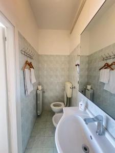 a bathroom with a sink and a toilet at moon 6 in Mestre
