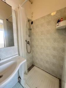 a bathroom with a white tub and a sink at moon 6 in Mestre