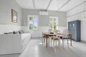 a kitchen with a table and chairs in a room at 6746-Hasle-Krakvej-3 in Hasle +15 photos