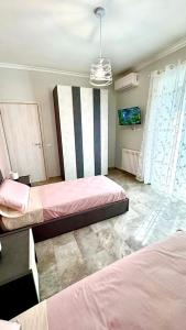 a bedroom with two beds in a room at Tor Vergata Smart Living in Rome