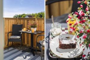 a slice of cake on a table on a balcony at 4790-Ronne-Kanegardsvej-12-1 in Rønne