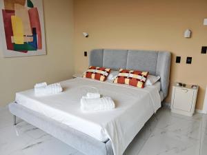 a bed with two pillows on it in a room at Sui Generis Montesilvano Colle in Montesilvano