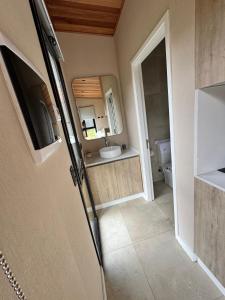 a bathroom with a sink and a toilet at Los Rebeldes in Baggle