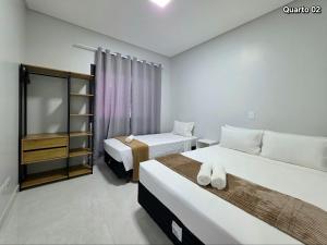 Postel nebo postele na pokoji v ubytování Casa novíssima 10 min das Cataratas 2 quartos