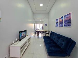 TV a/nebo společenská místnost v ubytování Casa novíssima 10 min das Cataratas 2 quartos