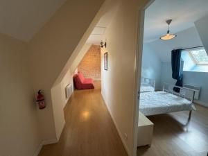 a room with a staircase leading to a bedroom at Domaine Saint Jean in Saint-Côme-du-Mont