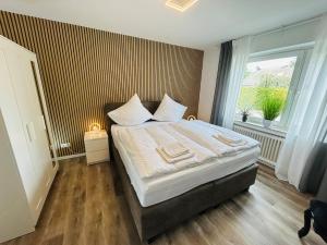 Postel nebo postele na pokoji v ubytování Fewo am Tüllinghof