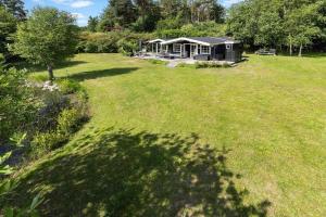 a house in the middle of a grass field at 6832-Hasle-Toftegardsvej-20-C in Hasle