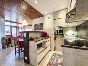a kitchen with a sink and a counter top at Residence De L'isere - Grand appartement dans le centre MAE-1713 in Val dʼIsère