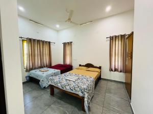 Ένα ή περισσότερα κρεβάτια σε δωμάτιο στο Cliffnest by Nivara 4BHK Luxury AC Villa in Varkala