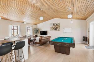 a living room with a pool table in it at 3691-Nexo-Stensebyvejen-32 in Neksø