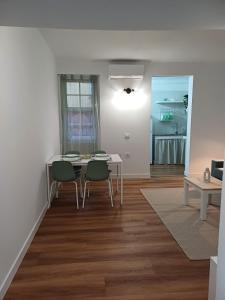 a dining room with a table and chairs in a room at El patio in Las Lagunas +16 photos