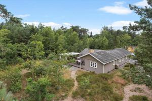 an aerial view of a house in the woods at 3671-Nexo-Dunhammervej-3 in Neksø