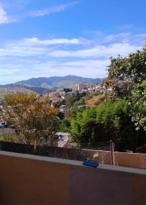 a view of a city from the roof of a house at Casa no Coração da Cidade in São Lourenço