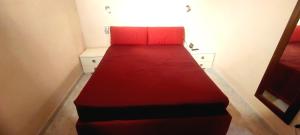 En eller flere senge i et værelse på Villino Indipendente