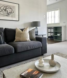 a living room with a couch and a table at Luxury 2 bedroom flat Gleneagles in Moffat