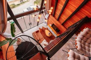 an overhead view of a balcony with a couch at Chalé com hidro e vista! in Imaruí